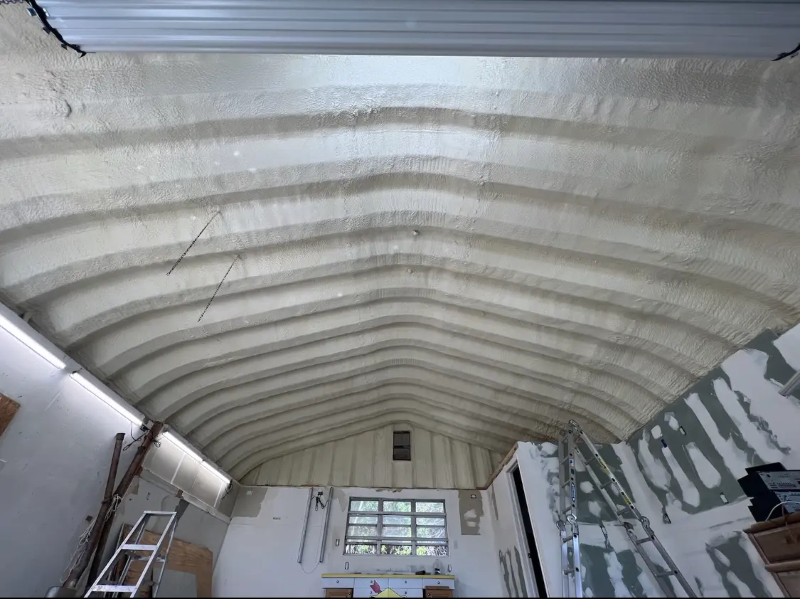 Spray polyurethane foam applied to the underside of a metal roof deck in Montgomery